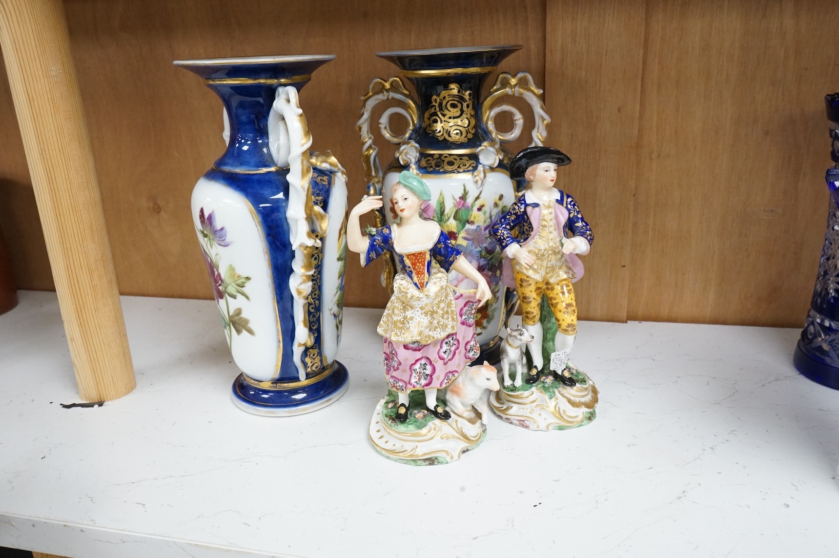 A pair of Samson figures and a pair of floral painted vases, largest 25cm high